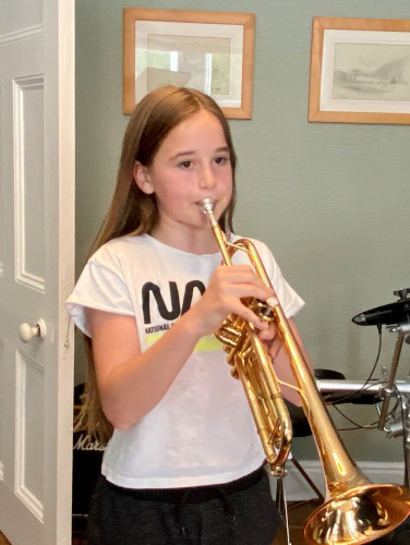 Izzy Playing Her Trumpet